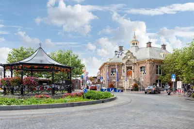 a gazebo on a street in front of a building at Vissershuisje Achterom 4 in Zandvoort