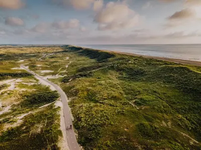 an aerial view of a road next to the ocean at Studio Elysium in Zandvoort