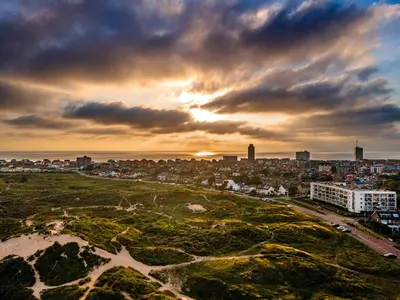 an aerial view of a city at sunset at Studio Elysium in Zandvoort