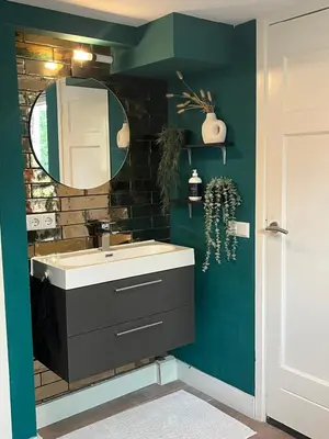 a bathroom with a sink and a mirror at Luxurious sunny beach villa in Noordwijk
