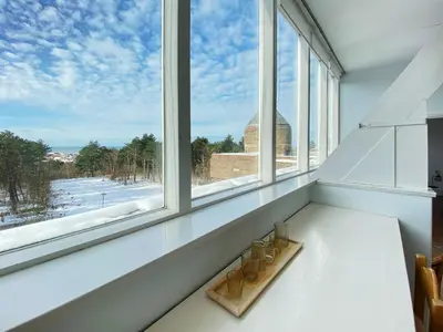 a pair of shoes sitting on a window sill at Apartment in Bergen aan Zee near Beach in Bergen aan Zee