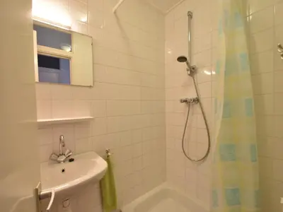 a bathroom with a shower and a sink at Apartment in Bergen aan Zee near Beach in Bergen aan Zee