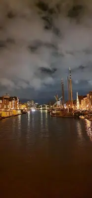 a view of a river at night with a city at Beautiful loft in Katwijk aan Zee in Katwijk aan Zee