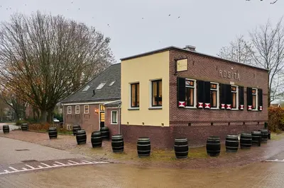 a building with trash cans in front of it at Appartement B Rosita in Twisk