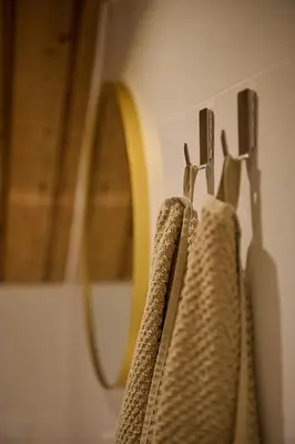 two towels hanging on a rack in a bathroom at Appartement B Rosita in Twisk