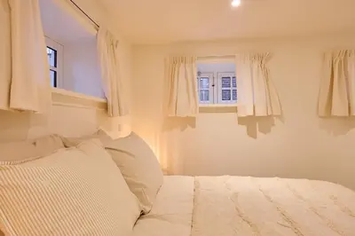 a bedroom with a bed and a window at Appartement B Rosita in Twisk