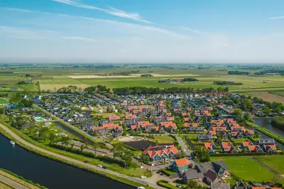 an aerial view of a town next to a river at Waterland De Beemster in West-Graftdijk