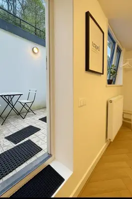 a door leading into a room with a table at Tiny House Bliss in Amsterdam