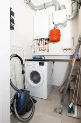 a laundry room with a washer and a washing machine at Hoorn Center - Dashing Hoorn in Hoorn