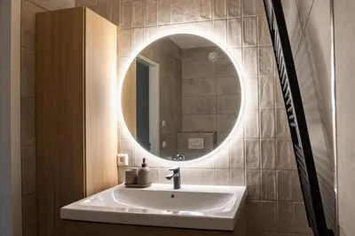 a bathroom with a sink and a mirror at Hoorn Center - Dashing Hoorn in Hoorn