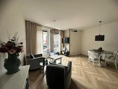 a living room with a couch and a table at Serviced Accommodation Hoorn - Corporate Housing NN38 in Hoorn