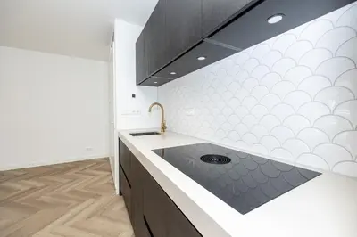 a kitchen with a sink and a counter top at Serviced Accommodation Hoorn - Corporate Housing NN38 in Hoorn