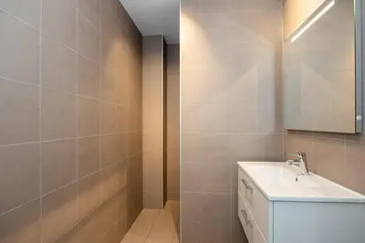 a bathroom with a sink and a mirror at Serviced Accommodation Hoorn - Corporate Housing NN38 in Hoorn