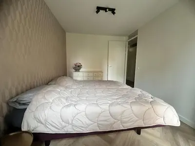 a bedroom with a large white bed in it at Serviced Accommodation Hoorn - Corporate Housing NN38 in Hoorn
