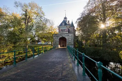 a bridge over a river with a building on top at Serviced Accommodation Hoorn - Corporate Housing NN38 in Hoorn