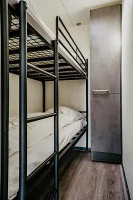 a bunk bed room with two bunk beds at Houseboat Uitgeest in Uitgeest