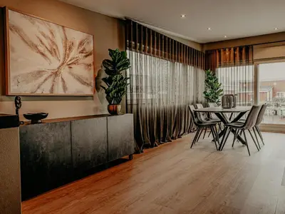 a dining room with a table and chairs at Houseboat Woude Uitgeest in Uitgeest
