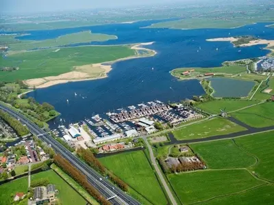an aerial view of a city and a river at Houseboat Campi Uitgeest in Uitgeest