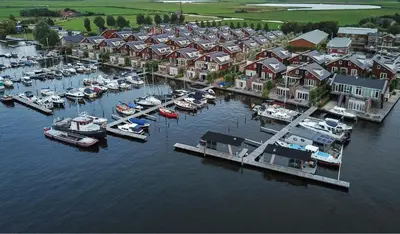 an aerial view of a marina with boats in the water at Houseboat Campi Uitgeest in Uitgeest
