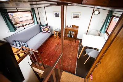 an overhead view of a living room in a tiny house at Marie's Houseboat in Amsterdam