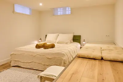 two beds in a room with two large beds at Appartement C Rosita in Twisk