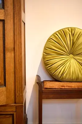 a large gold plate sitting on a wall at Appartement C Rosita in Twisk