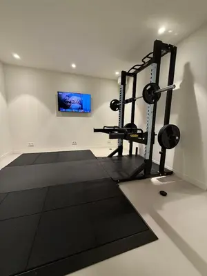 a fitness room with a gym with weights at Elements The Residence Luxe villa en guesthouse in Bergen