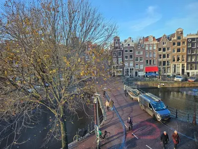 a view of a city with buildings and a street at As Home in Amsterdam