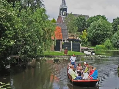 a group of people in a boat on a river at 