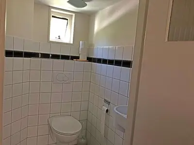 a bathroom with a toilet and a sink at 