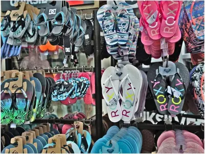 a store filled with lots of hats and shoes at 