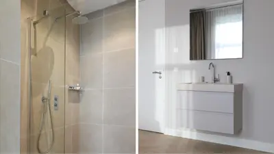 a bathroom with a shower and a sink and a mirror at Dam Residence - Boutique Hotel in Zaandam