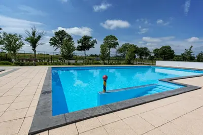a swimming pool with a red ball in the middle at De Beemster | Group accommodation near Amsterdam in West-Graftdijk