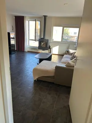 a living room with a bed and a table at Fokkeboom in Almere