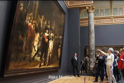 a group of people looking at a painting in a museum at Top Floor Apartment Vondelpark in Amsterdam