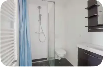 a bathroom with a glass shower with a toilet at Studio Mokum in Amsterdam