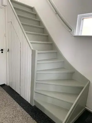 a staircase in a home with white walls at Botanico - family house in Egmond aan Zee