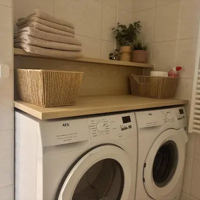 a washing machine with two baskets on top of it at Casa Amare in Egmond aan Zee