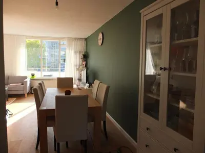 a dining room with a table and chairs at Cozy 2 Bedroom Home Away from Home in Amsterdam