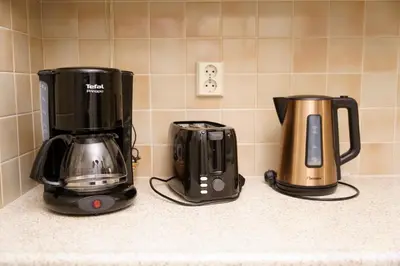 two appliances sitting on a counter in a kitchen at Lighthouse Beach Apartment in Noordwijk aan Zee