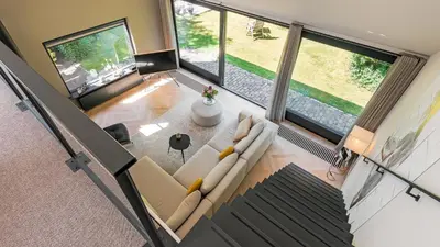 an overhead view of a living room with large windows at Villa Zonnelicht in Bergen