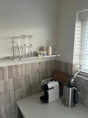 a kitchen with a counter top with a coffee maker on a counter at Studio34 in Hauwert