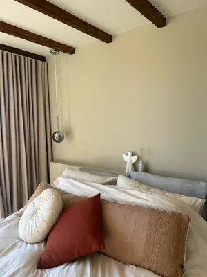 a bed with two pillows on it in a room at Studio34 in Hauwert