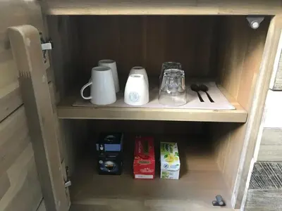 a cupboard with various items on it at Villa Yburg in Amsterdam