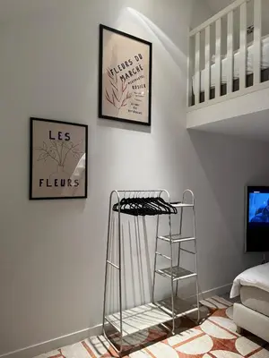 a room with a ladder and two pictures on the wall at Stylish apartment near Amsterdam in Badhoevedorp