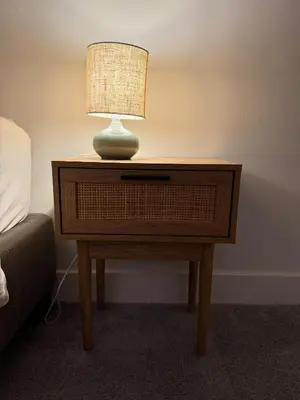 a lamp on a table next to a bed at Stylish apartment near Amsterdam in Badhoevedorp