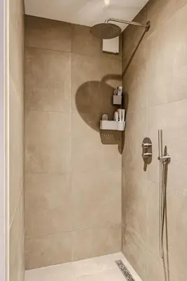 a bathroom with a shower with a shower head at Stylish apartment near Amsterdam in Badhoevedorp