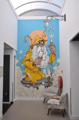 a mural in a room with a santa claus on the wall at Hotel Rauw aan de Kade in IJmuiden