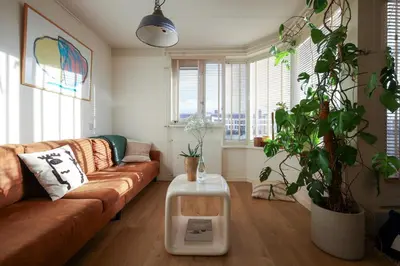 a living room with a couch and a table at East-Side Living in Amsterdam
