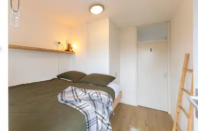 a bedroom with a bed in a room at East-Side Living in Amsterdam